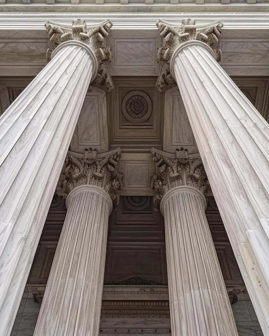 Columns of the courthouse where the firm appears for its clients